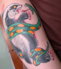 tattoo of badger fighting snake