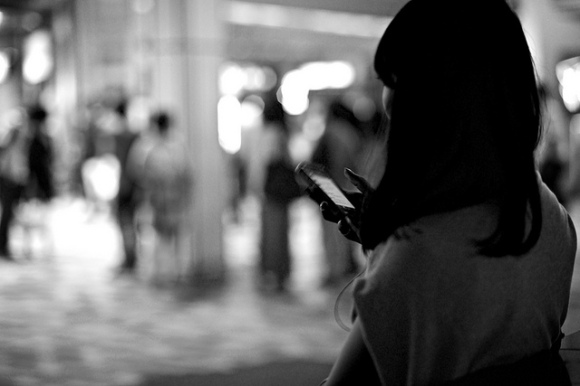 girl on iPhone black and white
