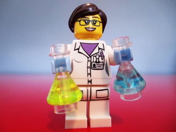 female scientist with two test tubes
