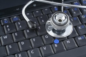 laptop keyboard and stethoscope